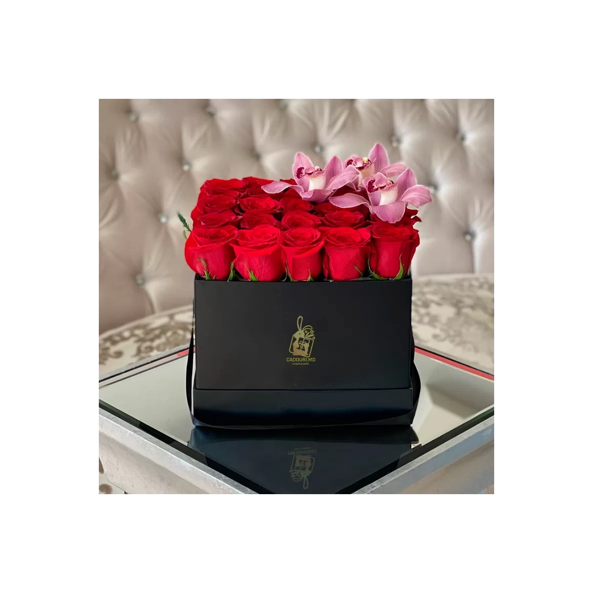 A square box with red roses and orchids photo