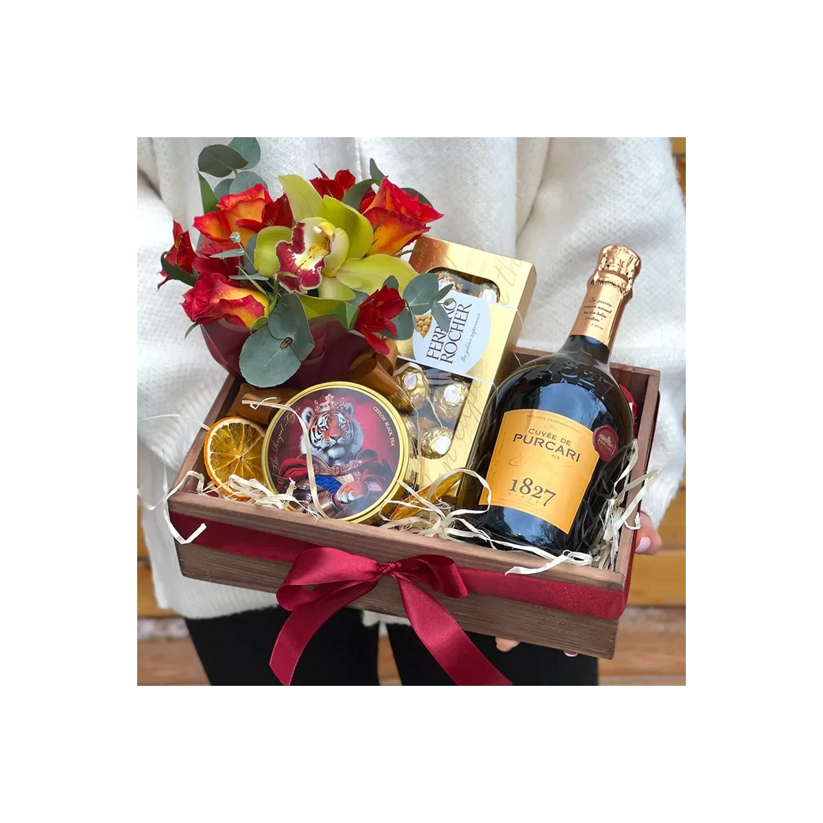 Gift box with champagne and flowers photo