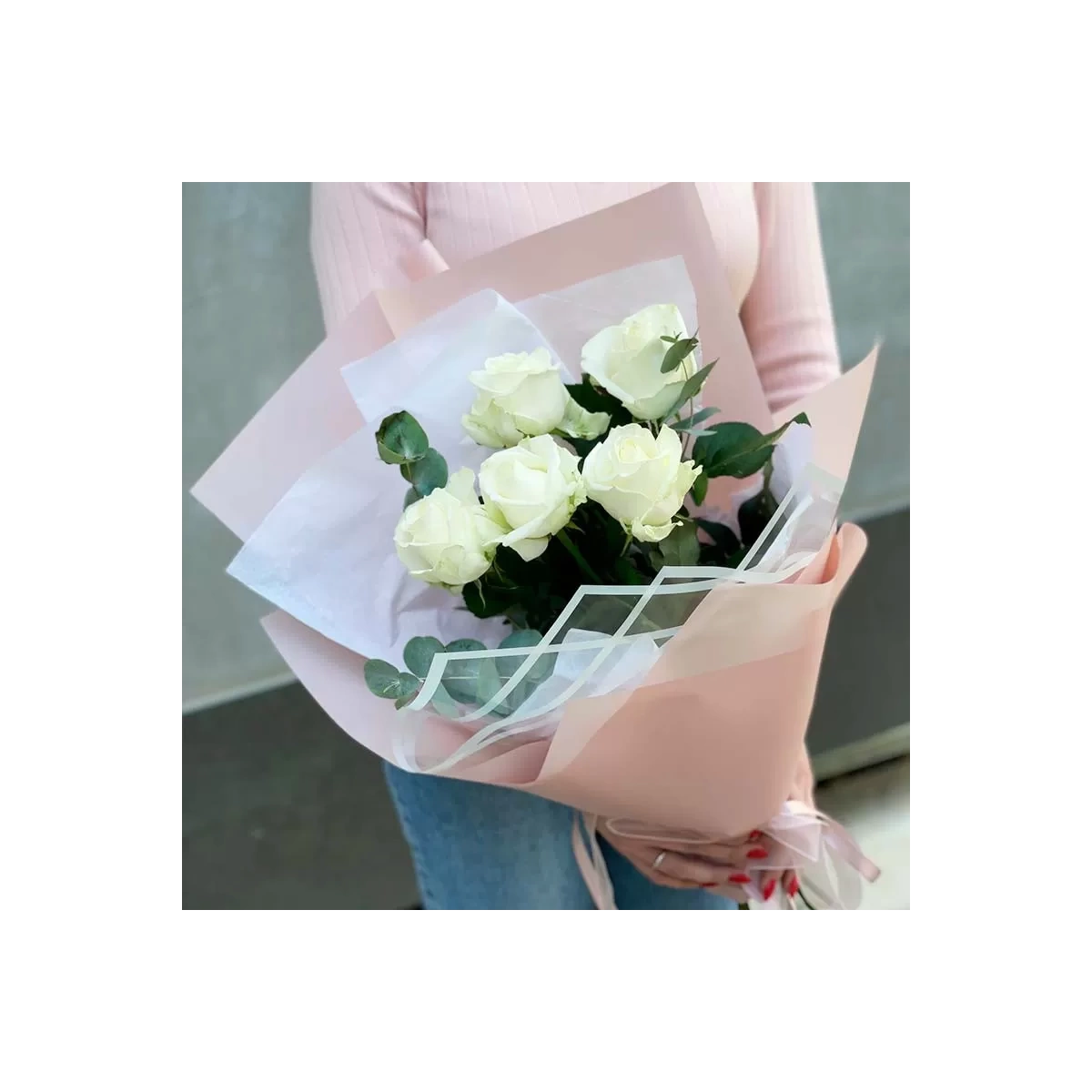 5 white roses in pink packaging photo