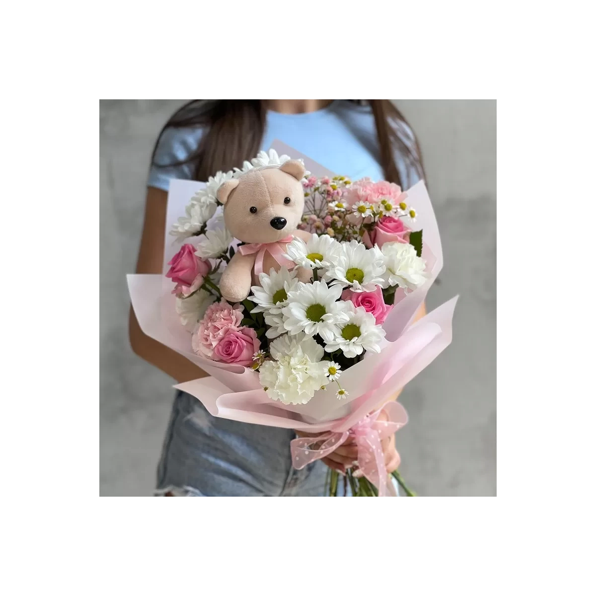 Bouquet of flowers and teddy bear