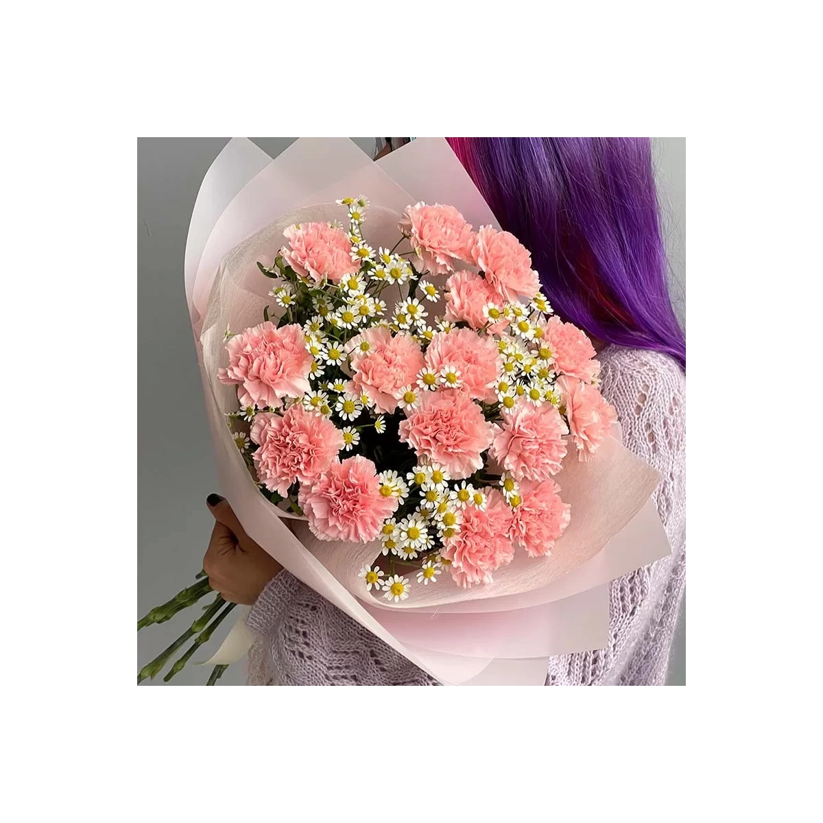 Bouquet of pink carnations with small daisies photo