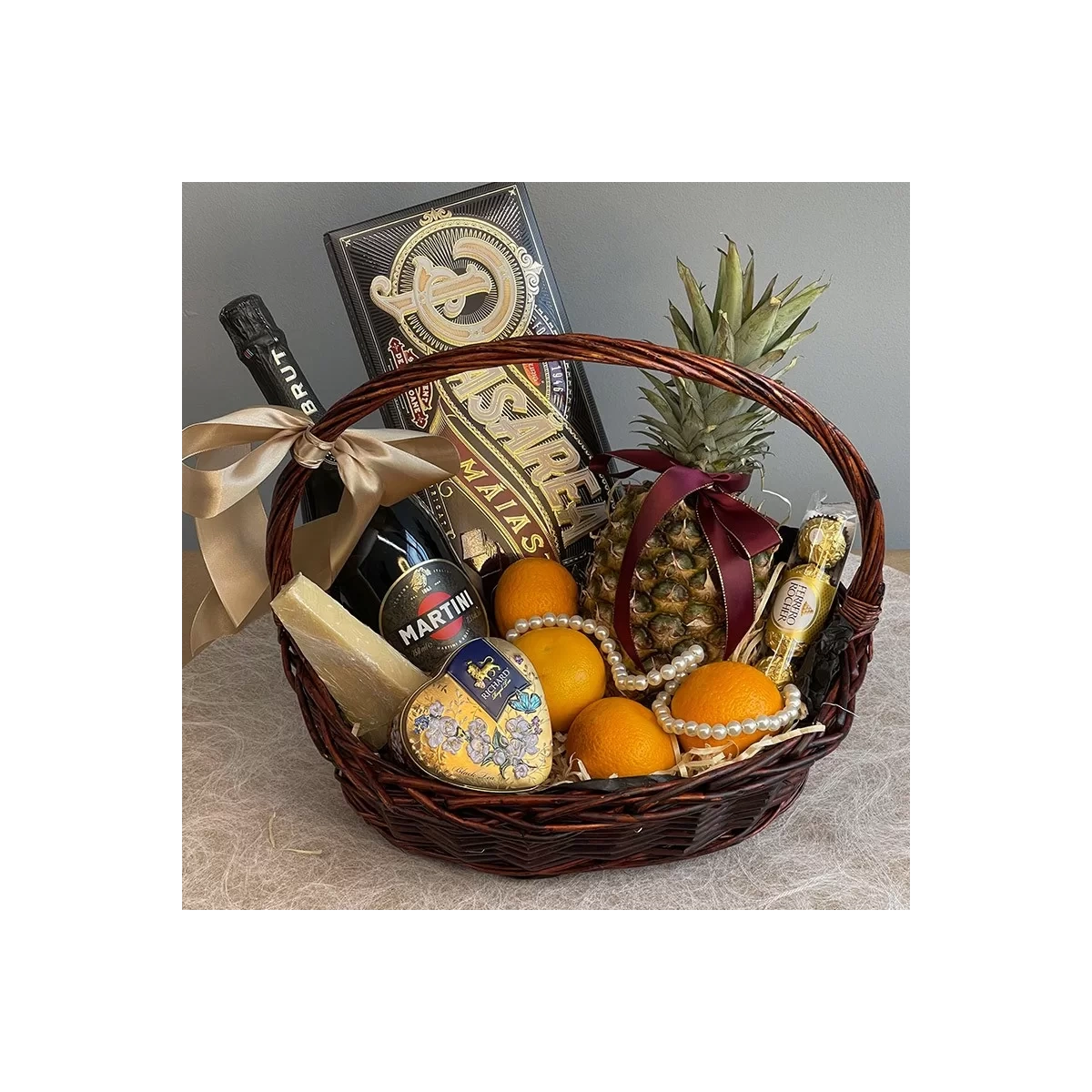 Gift basket with champagne and sweets in Gatsby style photo