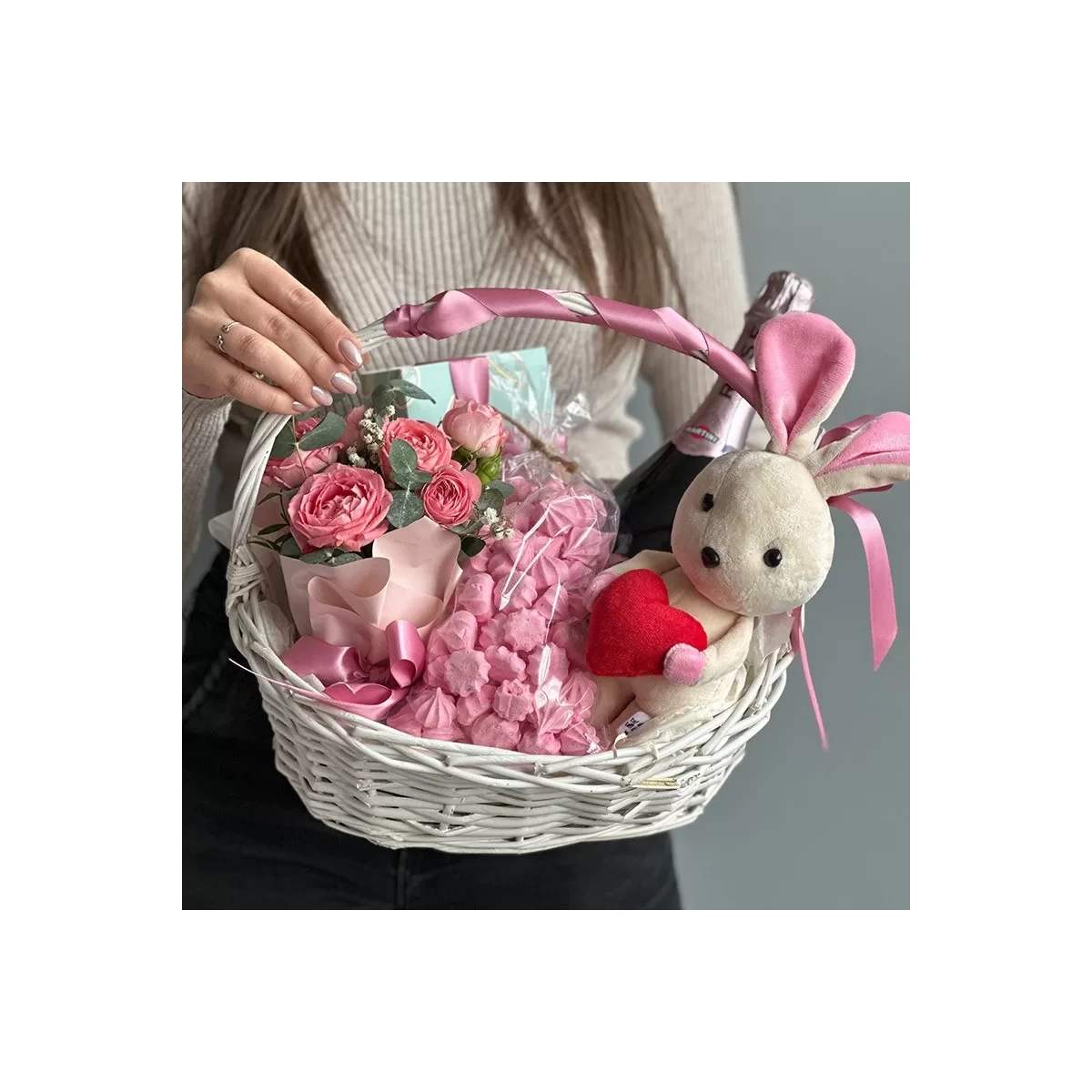 Small basket with a bunny and sweets photo