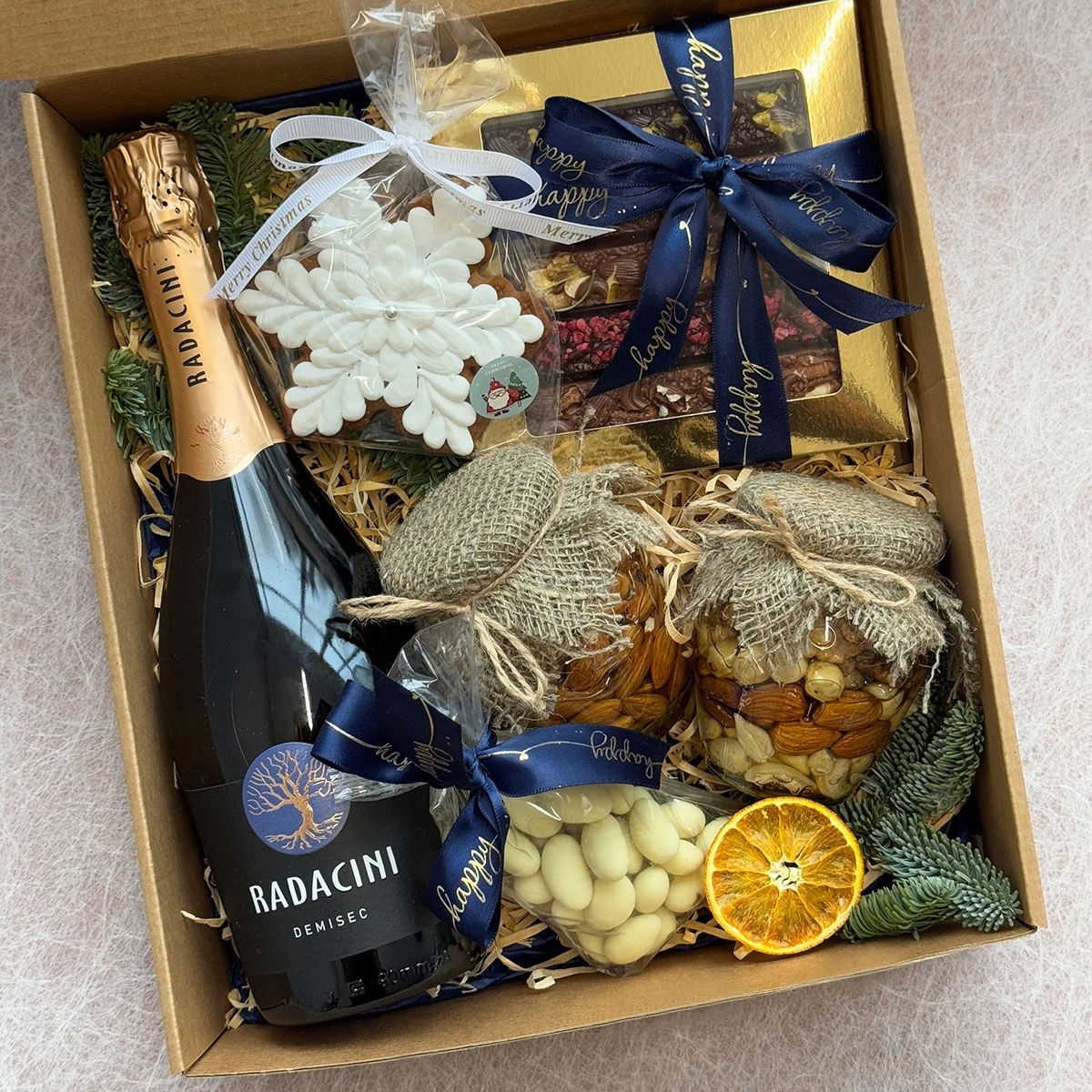 gift set with champagne, honey and sweets photo