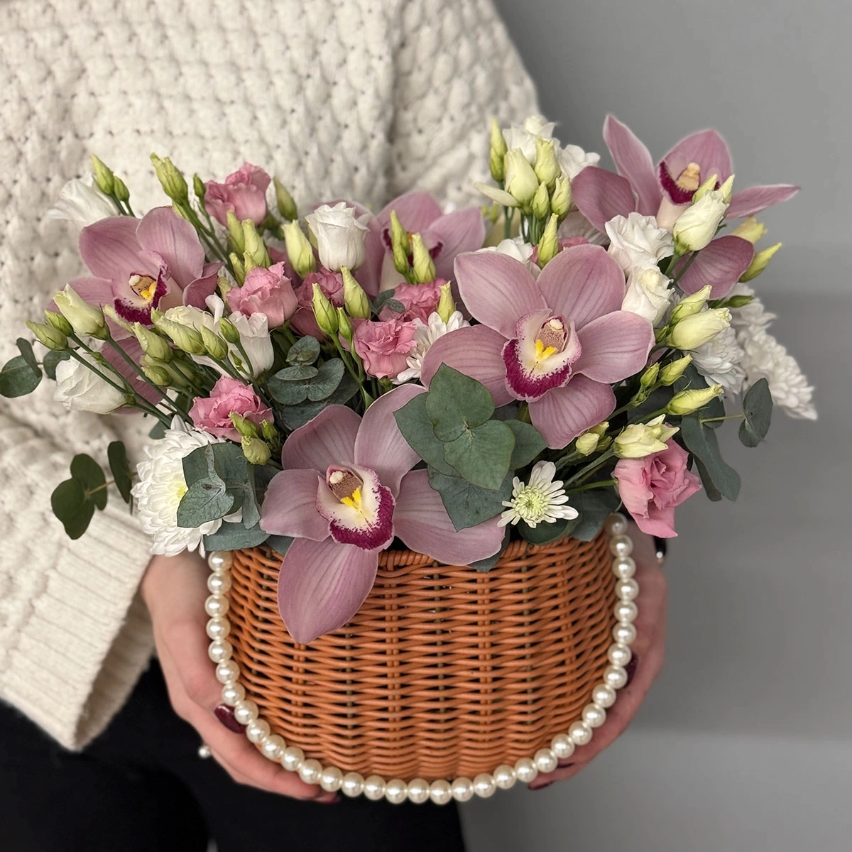 Composition in a Basket with Pink Orchids photo