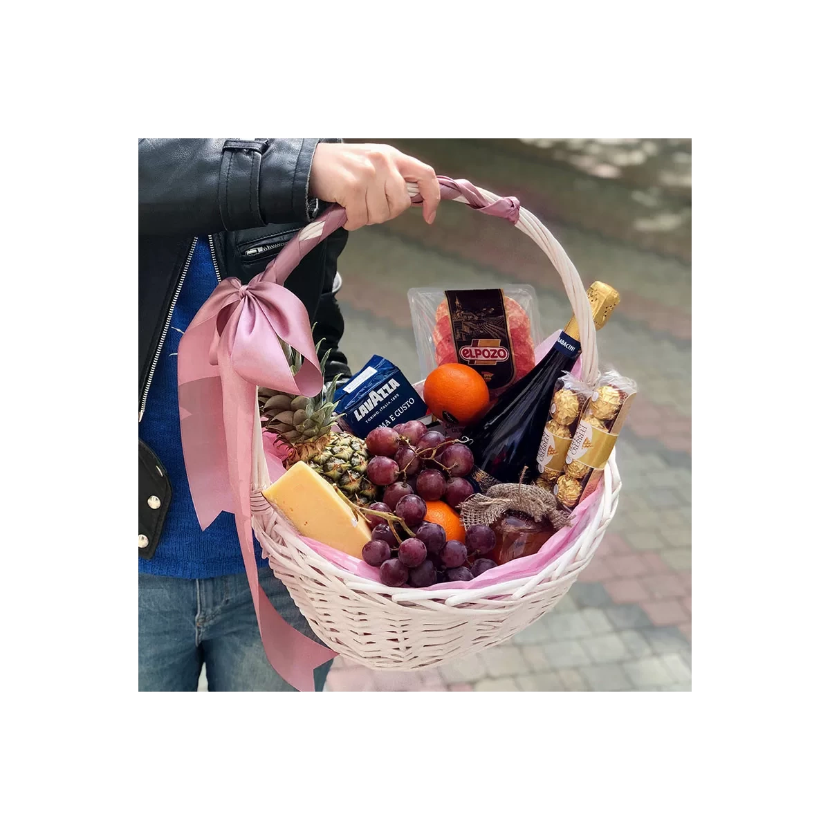 Basket with grapes and cheese photo